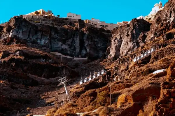 The caldera cliff above the old port of Fira with the cable car and the zigzag path