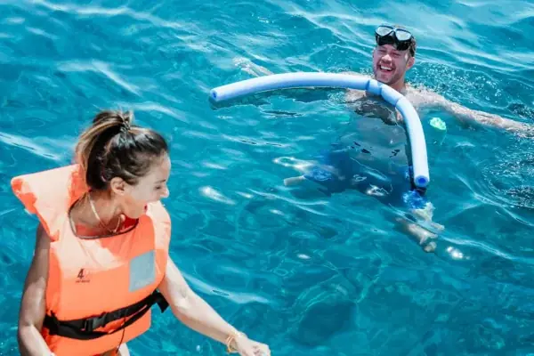 Life vests on and into the clear Aegean — a swim stop from our catamaran