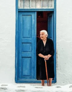 Grandmother of the Sirigos family at her doorway