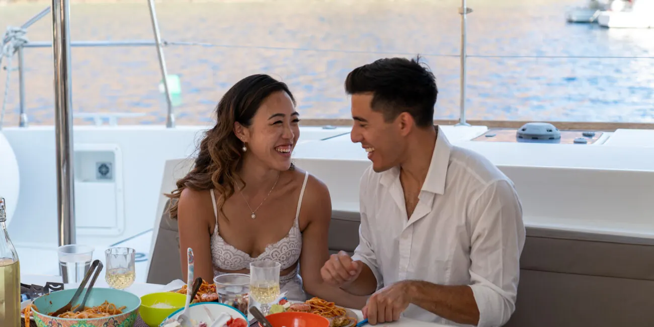 Lunch cooked on board and served on deck during a Santorini cruise
