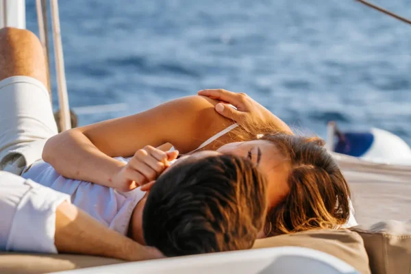 Golden-hour rest on deck during a Santorini sailing cruise